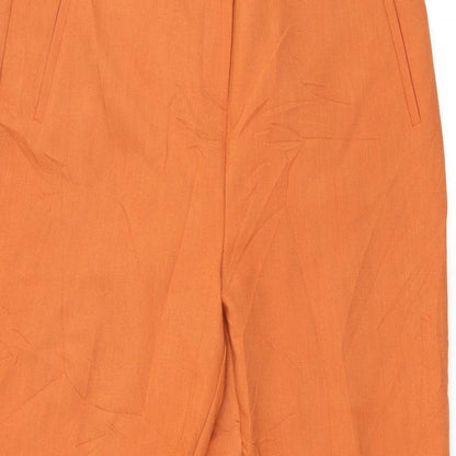 Close-up detail of Pieces women’s orange trousers, size L, 28-inch leg