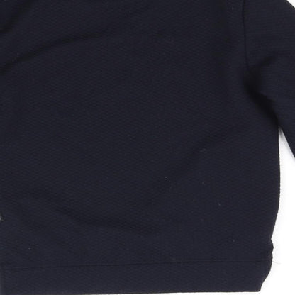 Brand and care label for Primark girls’ blue jumper, size 8-9, years