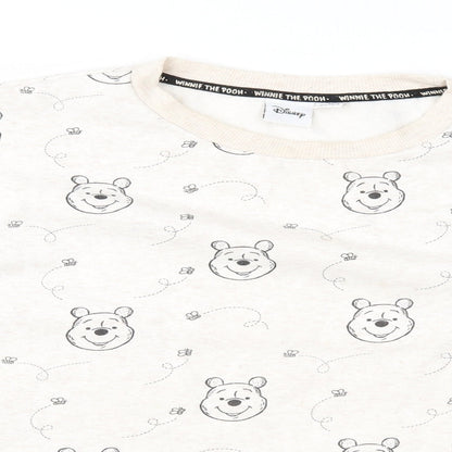 Close-up detail of Disney women’s beige geometric pullover sweatshirt, size M, - winnie the pooh