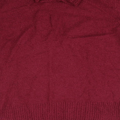 Brand and care label for Kliss women’s purple jumper, size L