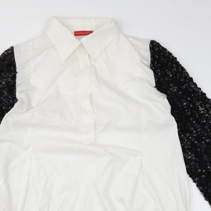 Close-up detail of embroideries gallery women’s white basic blouse, size L