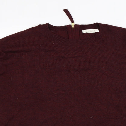 Close-up detail of H&M women’s red jumper, size S