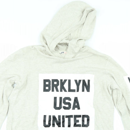Close-up detail of H&M girls’ beige pullover hoodie, size 13-14, years