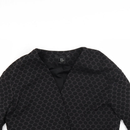 Close-up detail of Preworn women’s grey polka dot jacket coat, size XS
