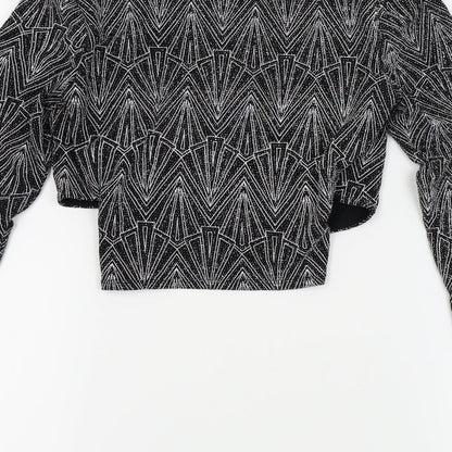 Brand and care label for H&M women’s silver basic blouse, size S