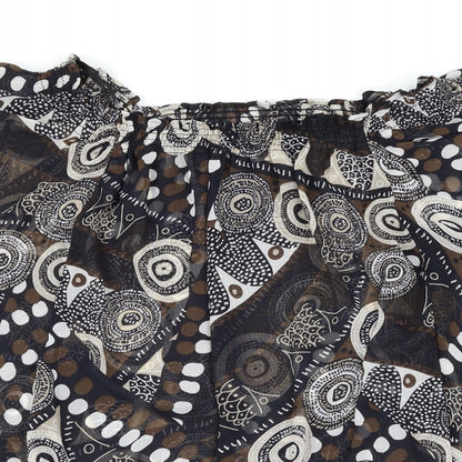 Close-up detail of Pimkie women’s black polka dot basic blouse, size UK 10, - batwing sleeve