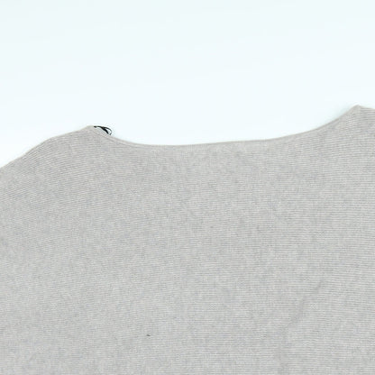 Close-up detail of H&M women’s pink jumper, size M