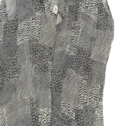 Close-up detail of Jupi women’s gold cape jumper, size UK 12