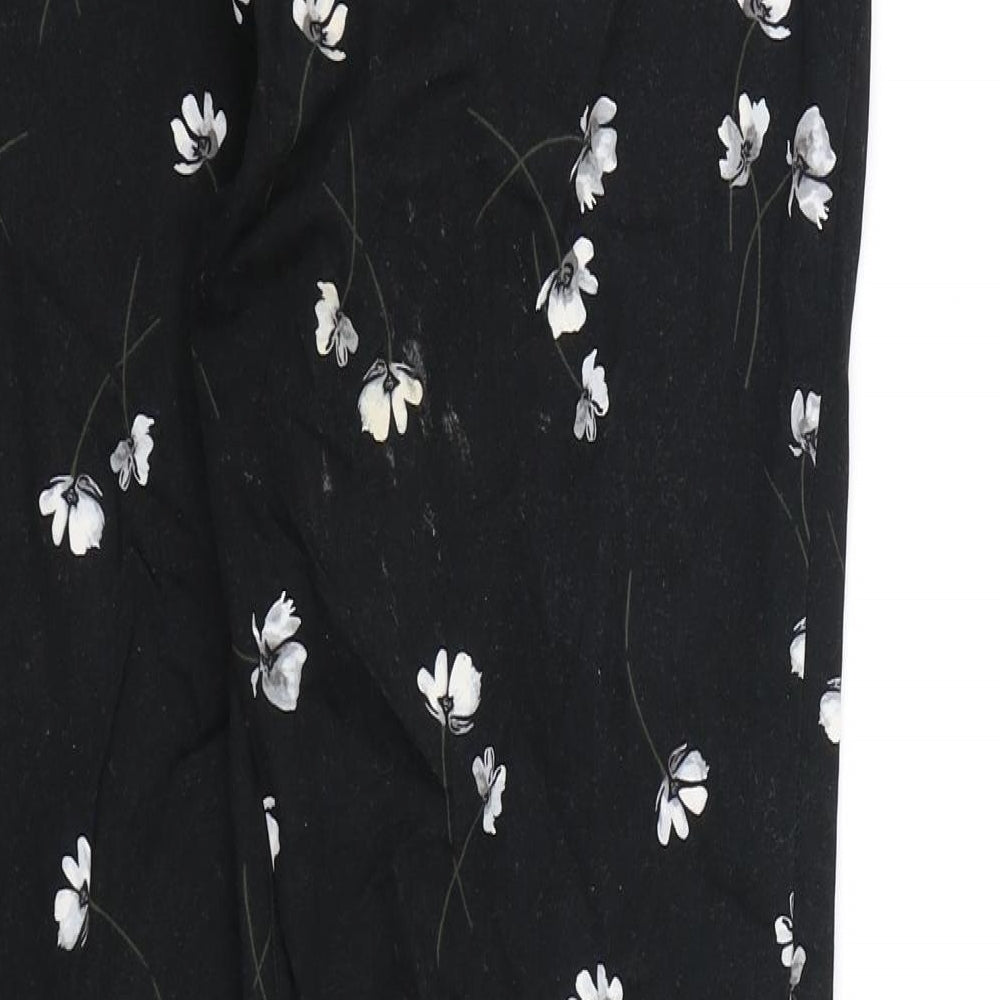 Brand and care label for RJR.John Rocha women’s black floral trousers, size UK 10, 26-inch leg