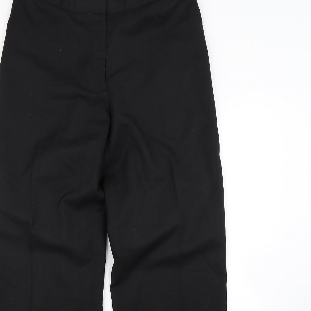 Close-up detail of Preworn women’s black dress pants trousers, size UK 32, in, 30-inch leg