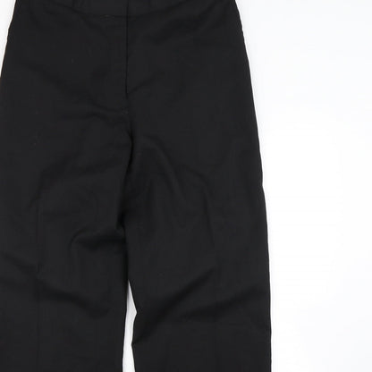 Close-up detail of Preworn women’s black dress pants trousers, size UK 32, in, 30-inch leg