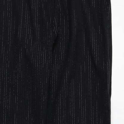 Close-up detail of Preworn women’s black trousers, size UK 16, 30-inch leg - silver metallised fibre