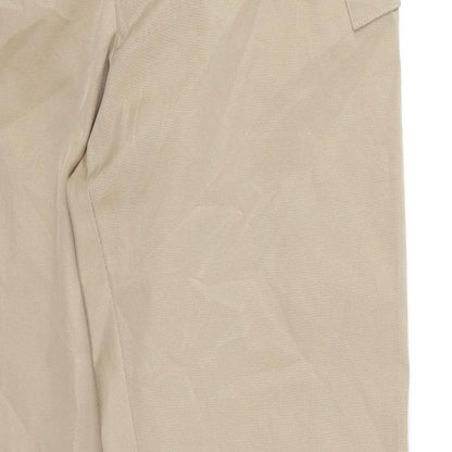 Close-up detail of Pretty Girl women’s brown chino trousers, size L, 27-inch leg