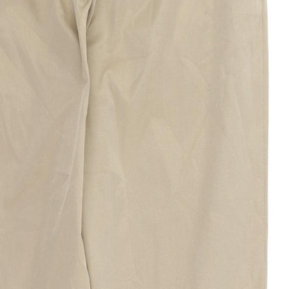 Brand and care label for Pretty Girl women’s brown chino trousers, size L, 27-inch leg