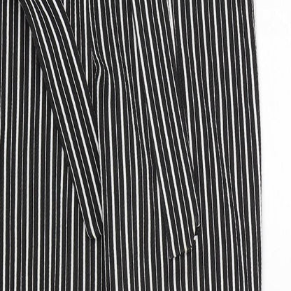 Close-up detail of PRETTYLITTLETHING women’s black striped trousers, size UK 10, 27-inch leg