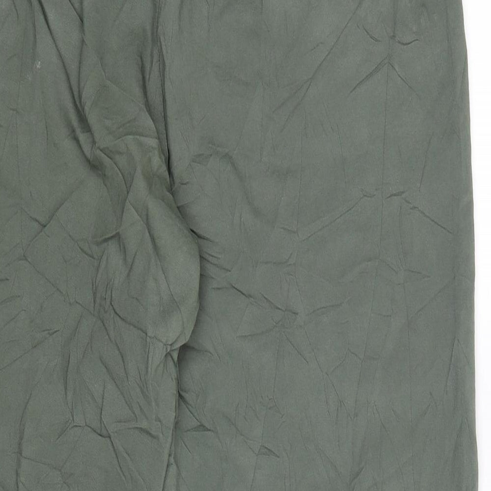 Brand and care label for VY women’s green cropped trousers, size UK 34, in, 21-inch leg