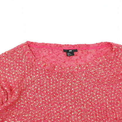 Close-up detail of H&M women’s pink jumper, size M