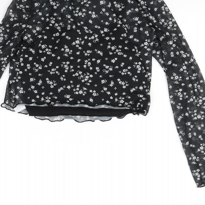 Brand and care label for New Look girls’ black polka dot basic blouse, size 10, years