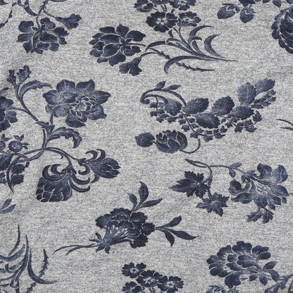 Brand and care label for Quiz women’s grey floral jumper, size UK 14
