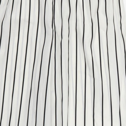 Brand and care label for Preworn women’s white striped trousers, size UK 31, in, 23-inch leg