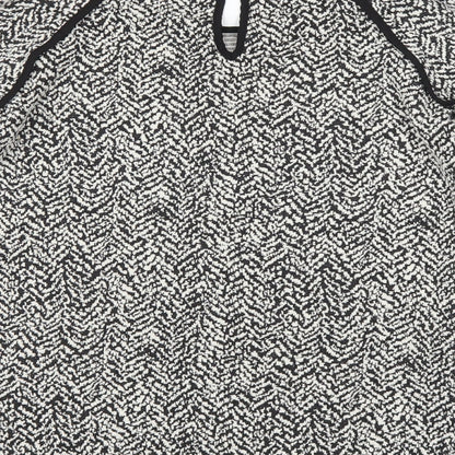 Brand and care label for Next women’s black polka dot jumper, size UK 8