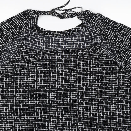 Brand and care label for Nutmeg women’s black check chiffon basic blouse, size UK 14