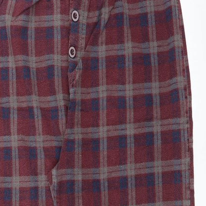 Close-up detail of Preworn women’s red trousers, size XL, 24-inch leg
