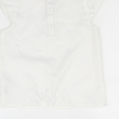 Brand and care label for Nutmeg girls’ white basic blouse, size 7-8, years