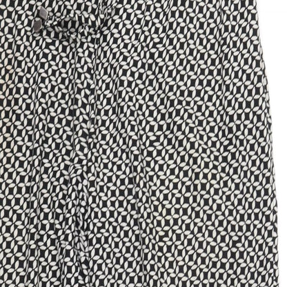 Close-up detail of Debenhams women’s black geometric trousers, size UK 12, 27-inch leg