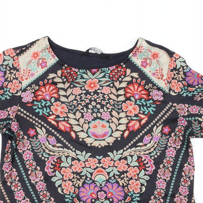 Close-up detail of Preworn women’s black floral basic t-shirt, size UK 6