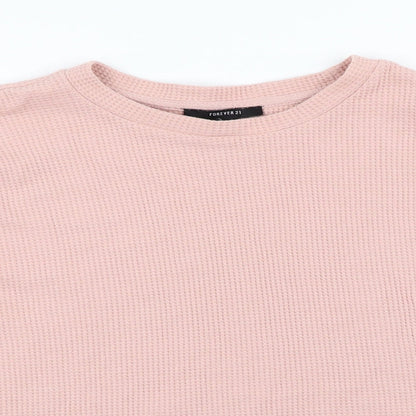 Close-up detail of Forever 21 women’s pink jumper, size M