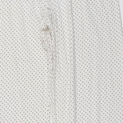 Brand and care label for Secret Obsessions women’s ivory polka dot trousers, size L, 22-inch leg