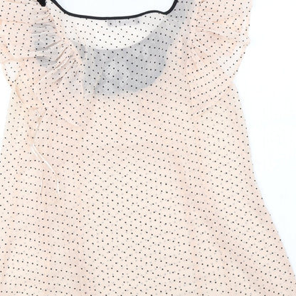 Brand and care label for Atmosphere women’s pink polka dot basic blouse, size UK 10