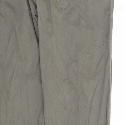 Brand and care label for Preworn women’s green pedal pusher trousers, size M, 25-inch leg
