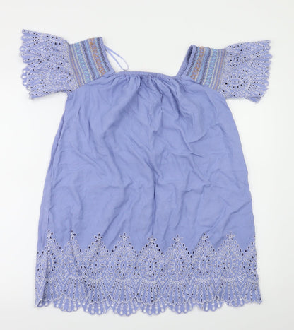 Back view of Resort women’s blue floral basic polo, size S