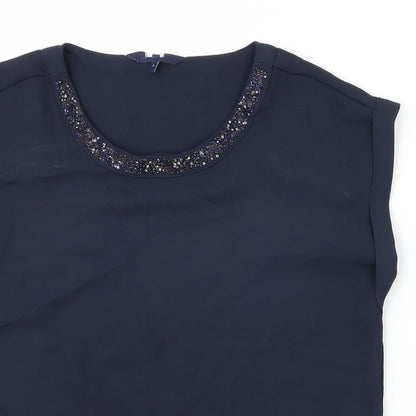 Close-up detail of Preworn women’s blue basic blouse, size UK 6