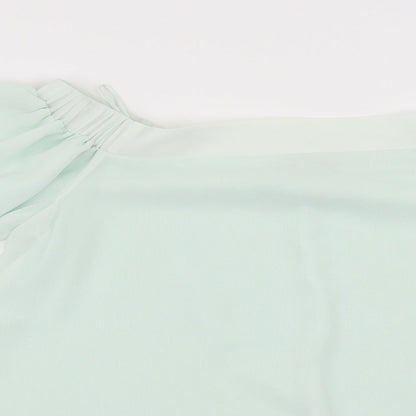 Close-up detail of Rive Island women’s green basic blouse, size UK 10