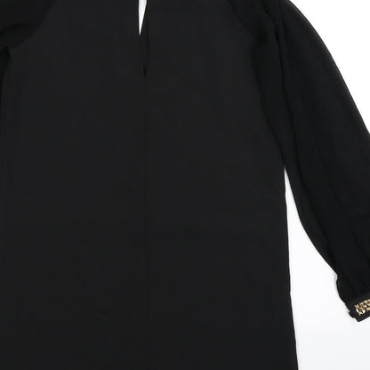 Brand and care label for Miss Selfridge women’s black mini, size UK 10