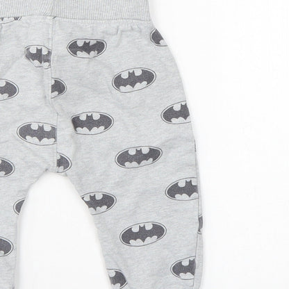Brand and care label for Batman boys’ grey sweatpants, size 6-9, months