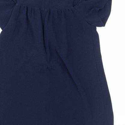 Brand and care label for Next girls’ blue pullover casual, size 7, years