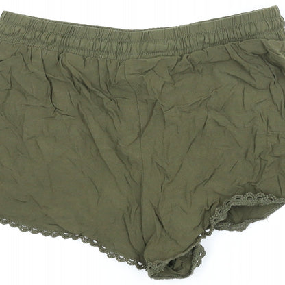 Brand and care label for Primark women’s green paperbag shorts, size UK 8