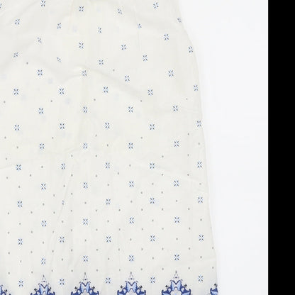 Brand and care label for H&M women’s white basic button-up, size UK 34