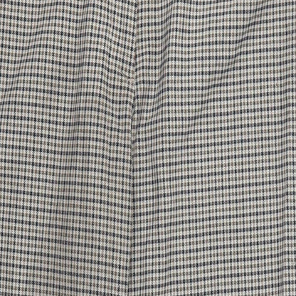 Close-up detail of H&M women’s brown check trousers, size UK 16, 25-inch leg