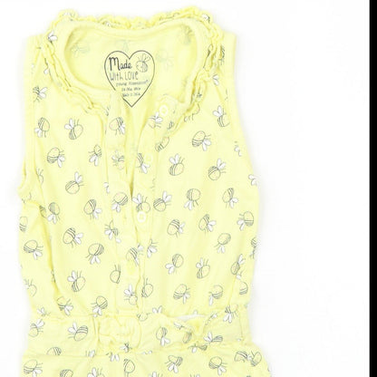 Close-up detail of Young Dimension girls’ yellow playsuit one-piece, size 2, years