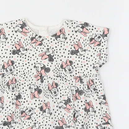Close-up detail of Disney Baby girls’ pink animal print fit & flare, size 6-9, months