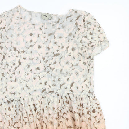 Close-up detail of ASOS women’s orange floral a-line, size UK 8