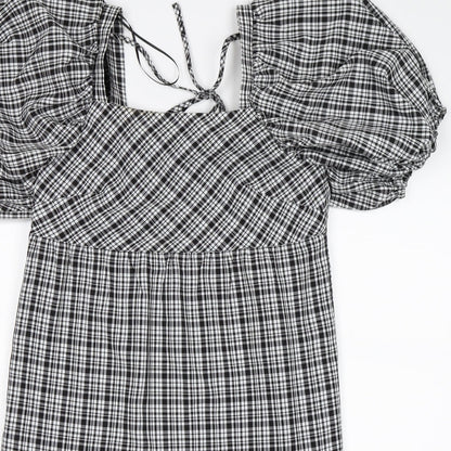 Close-up detail of Papaya women’s black check shift, size UK 8