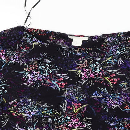 Close-up detail of H&M women’s black floral basic blouse, size UK 14