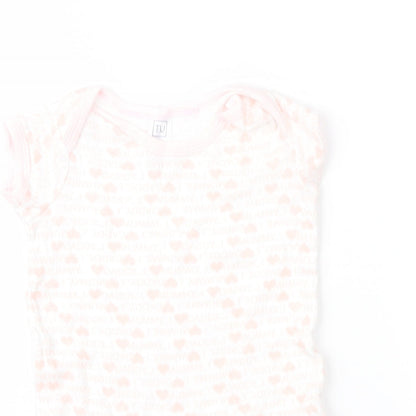 Close-up detail of Tu girls’ pink geometric romper one-piece, size 3-6, months