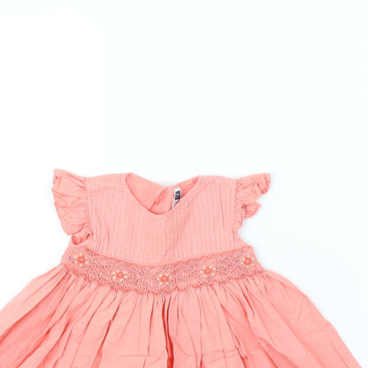 Close-up detail of M&Co girls’ pink fit & flare, size 12, months